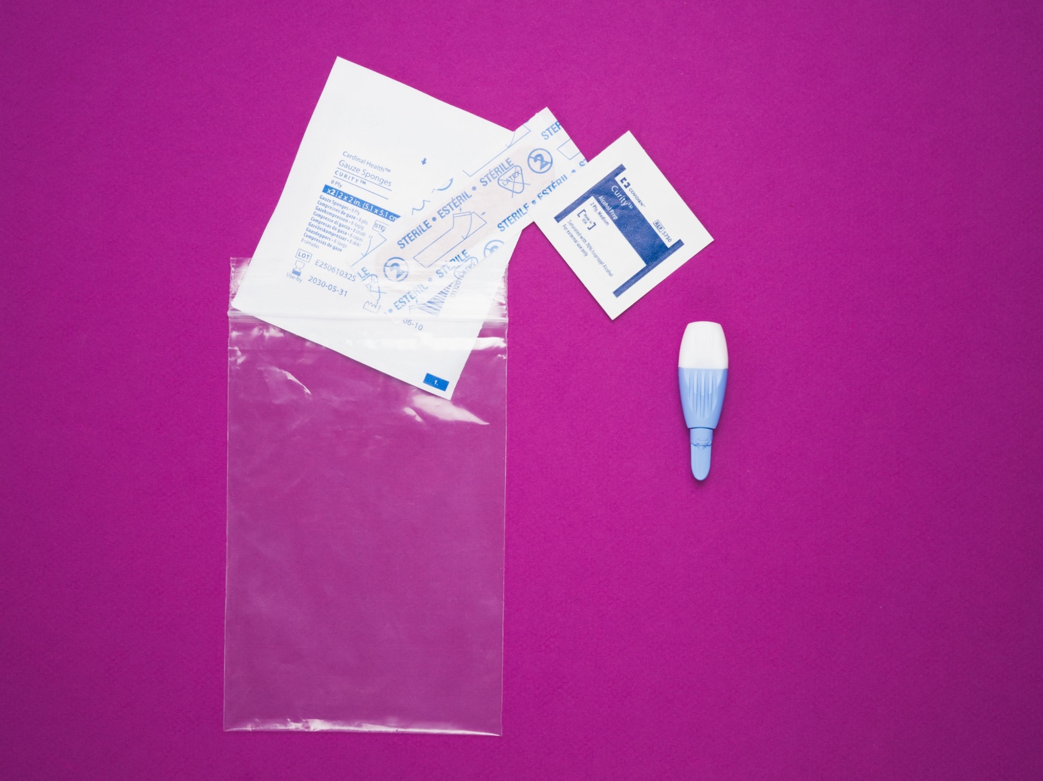 PreTRM collection materials arranged on a magenta surface